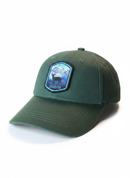 Moove Headwear dark green adjustable strapback baseball cap with a patch featuring a bighorn sheep and mountains, representing Colorado.