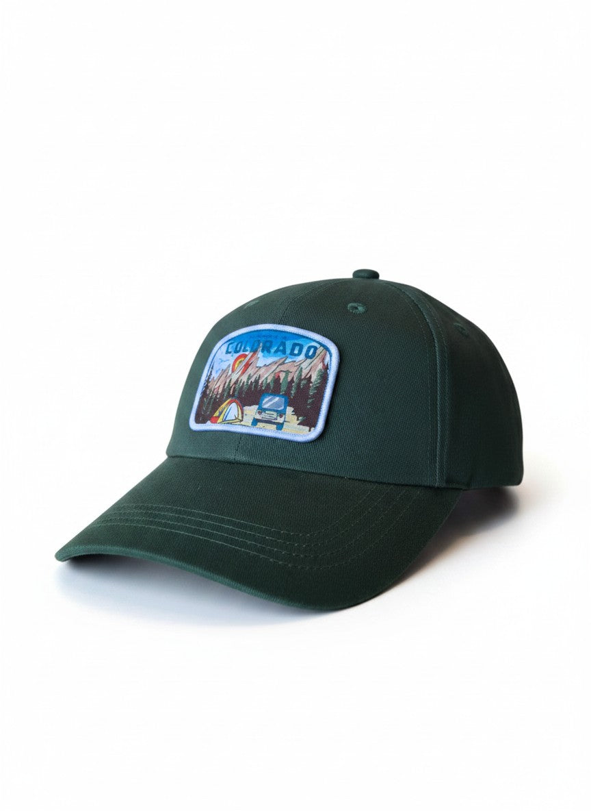 Moove Headwear dark green cotton dad hat with a "My Heart is in Colorado" patch featuring mountains, trees, tent, and vehicle.