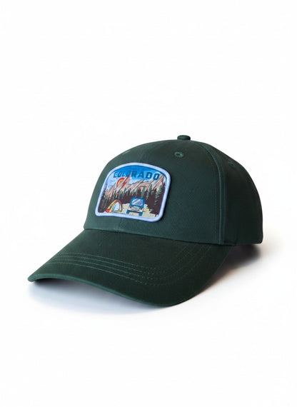 Moove Headwear dark green cotton dad hat with a "My Heart is in Colorado" patch featuring mountains, trees, tent, and vehicle.