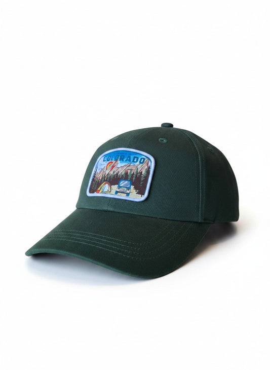 Moove Headwear dark green cotton dad hat with a "My Heart is in Colorado" patch featuring mountains, trees, tent, and vehicle.