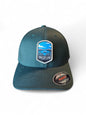 Moove Headwear Crater Lake National Park patch on a dark teal Flexfit cap with a structured crown and embroidered details.