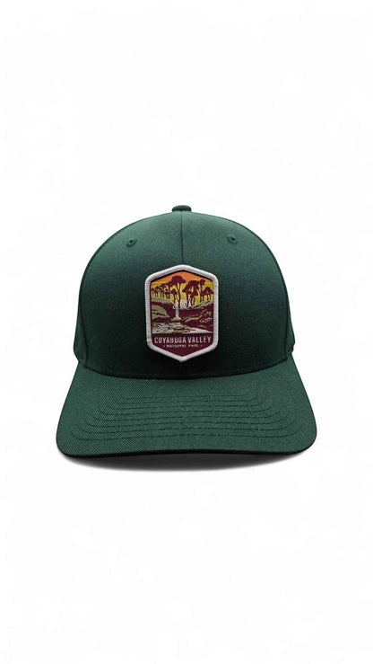 Moove Headwear dark green embroidered dad cap with Cuyahoga Valley National Park patch and curved brim.