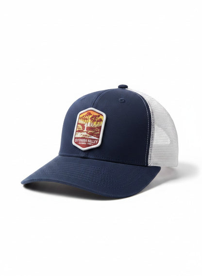 Moove Headwear navy blue trucker hat with embroidered Cuyahoga Valley National Park logo and white mesh back.