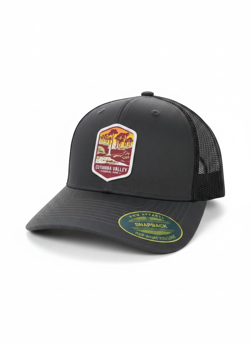 Moove Headwear dark grey trucker hat with Cuyahoga Valley National Park embroidered patch and mesh back.