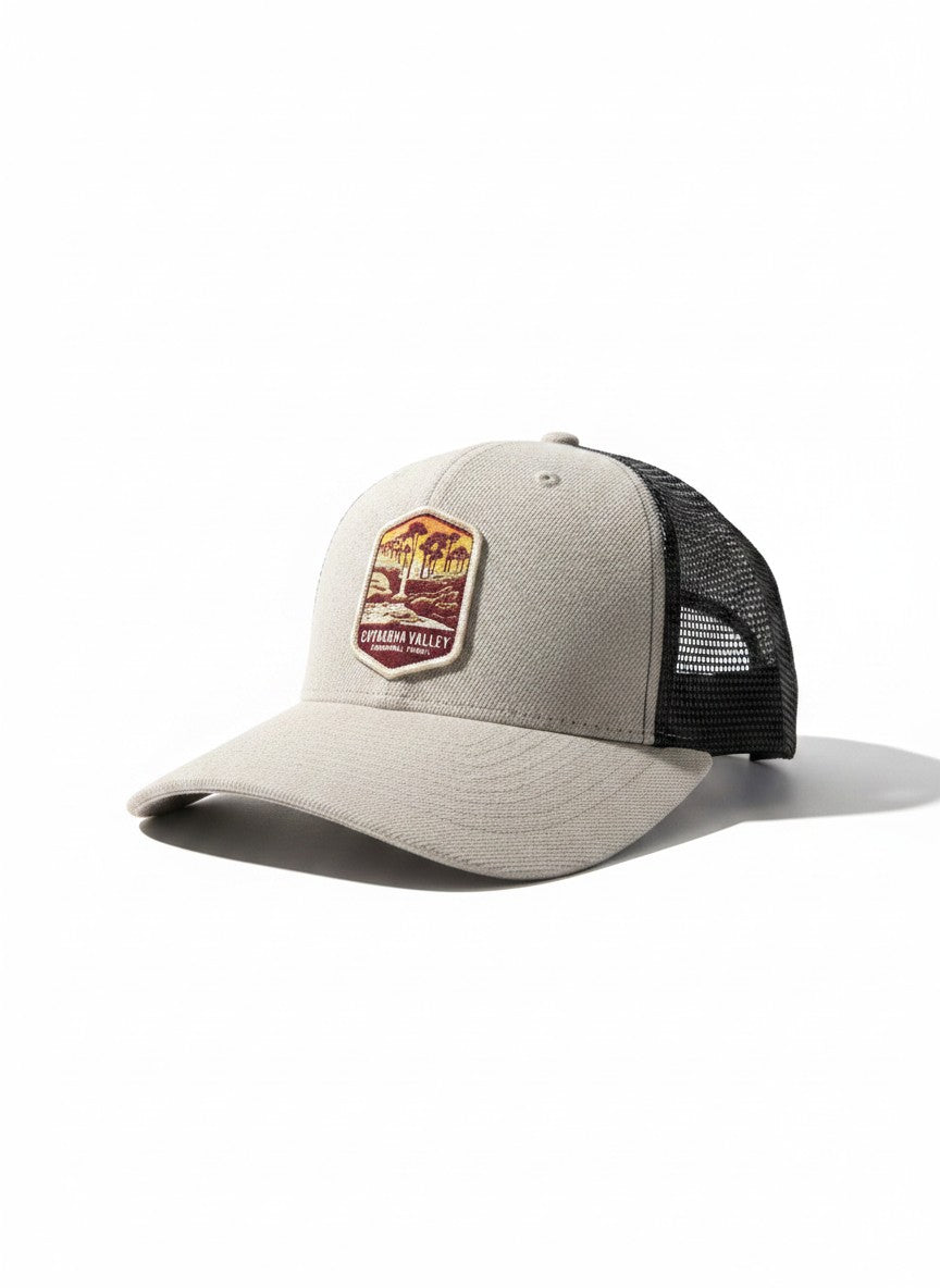 Moove Headwear beige trucker hat with Cuyahoga Valley National Park logo embroidery and black mesh back.