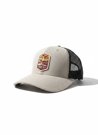 Moove Headwear beige trucker hat with Cuyahoga Valley National Park logo embroidery and black mesh back.