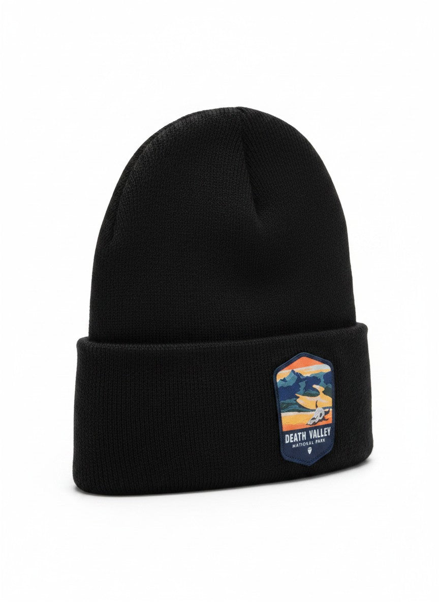 Moove Headwear black knit beanie with a Death Valley National Park patch featuring mountains and a skull.