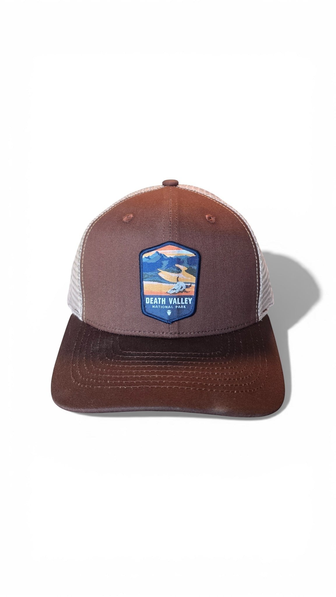Moove Headwear brown trucker hat with Death Valley National Park patch and breathable mesh back.