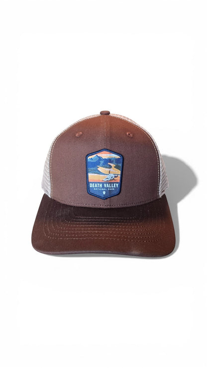 Moove Headwear brown trucker hat with Death Valley National Park patch and breathable mesh back.