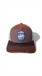 Moove Headwear brown trucker hat with Death Valley National Park patch and breathable mesh back.
