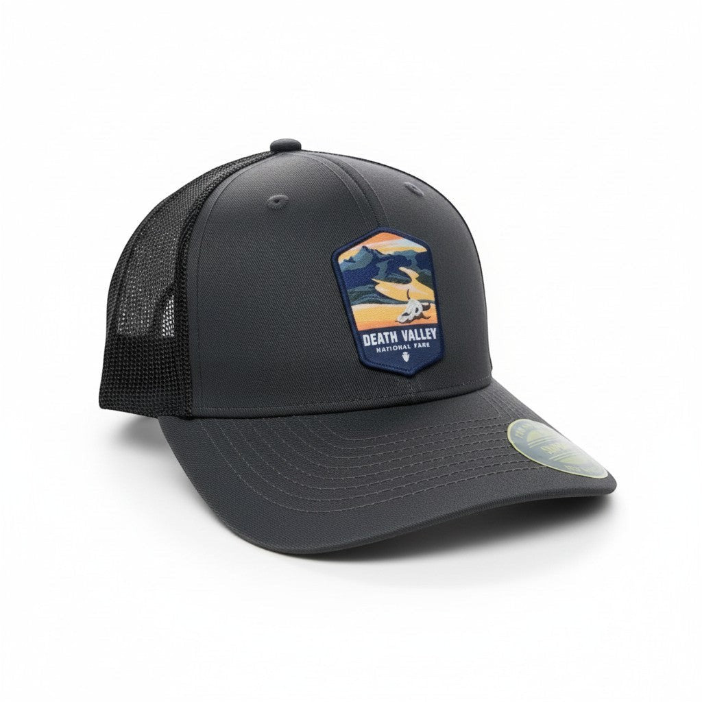 Moove Headwear dark grey trucker hat with breathable mesh back and Death Valley National Park embroidered patch.