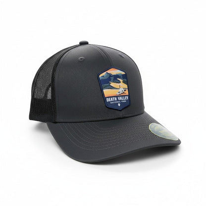 Moove Headwear dark grey trucker hat with breathable mesh back and Death Valley National Park embroidered patch.