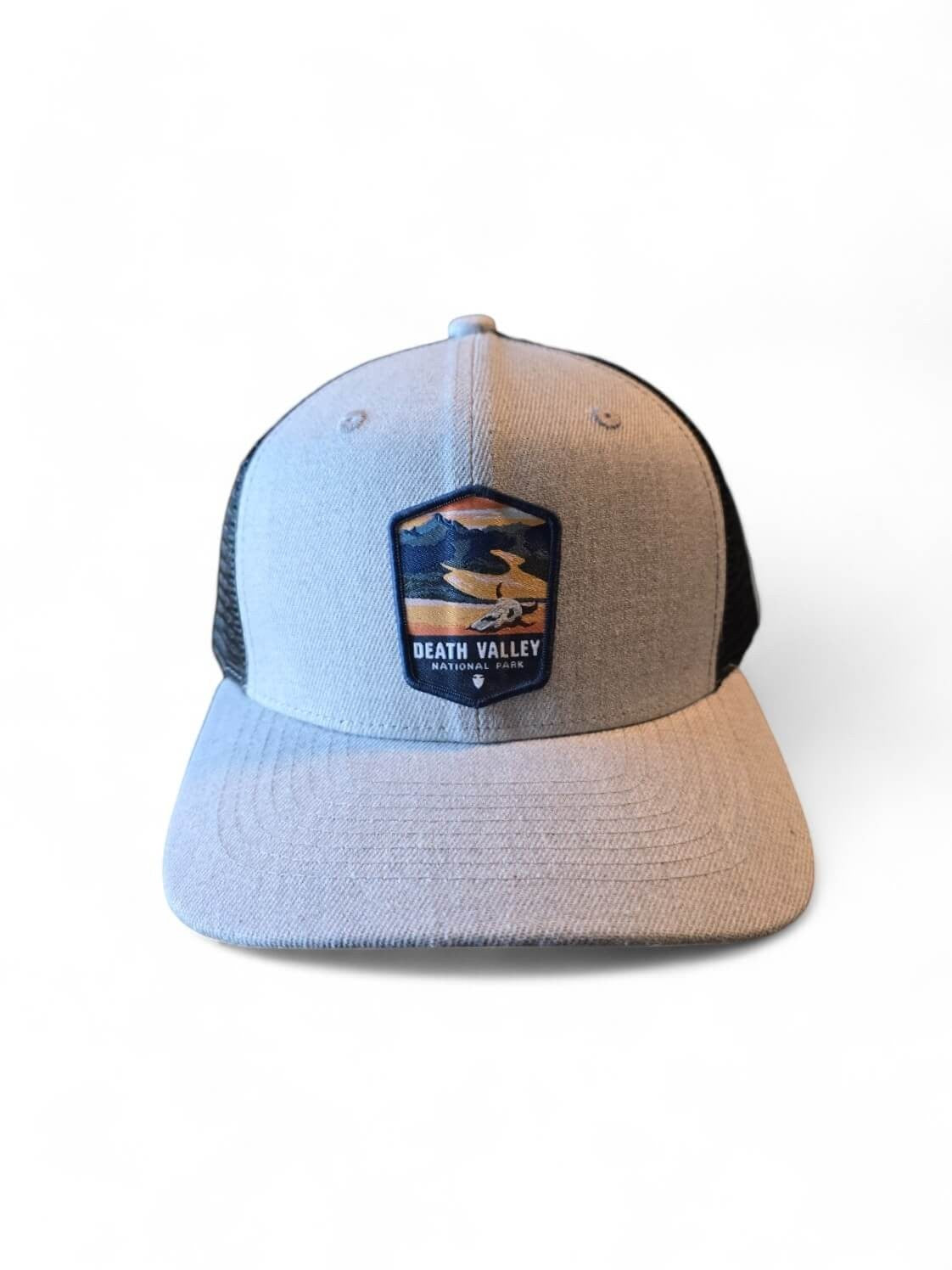 Moove Headwear grey and black trucker hat with breathable mesh and adjustable snapback, featuring a Death Valley National Park patch.