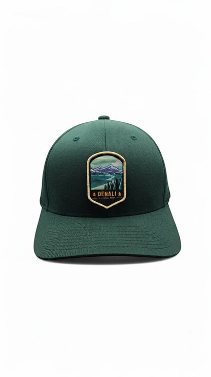 Moove Headwear dark green fitted baseball cap with Denali National Park embroidered patch featuring mountains and trees.