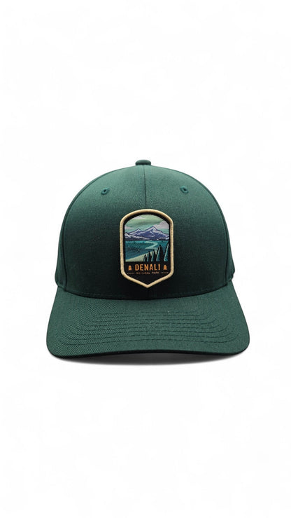 Moove Headwear green fitted baseball cap with Denali National Park embroidered patch featuring mountains and trees.