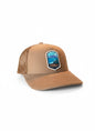 Moove Headwear Denali National Park trucker hat in tan suede with mesh back and embroidered patch.