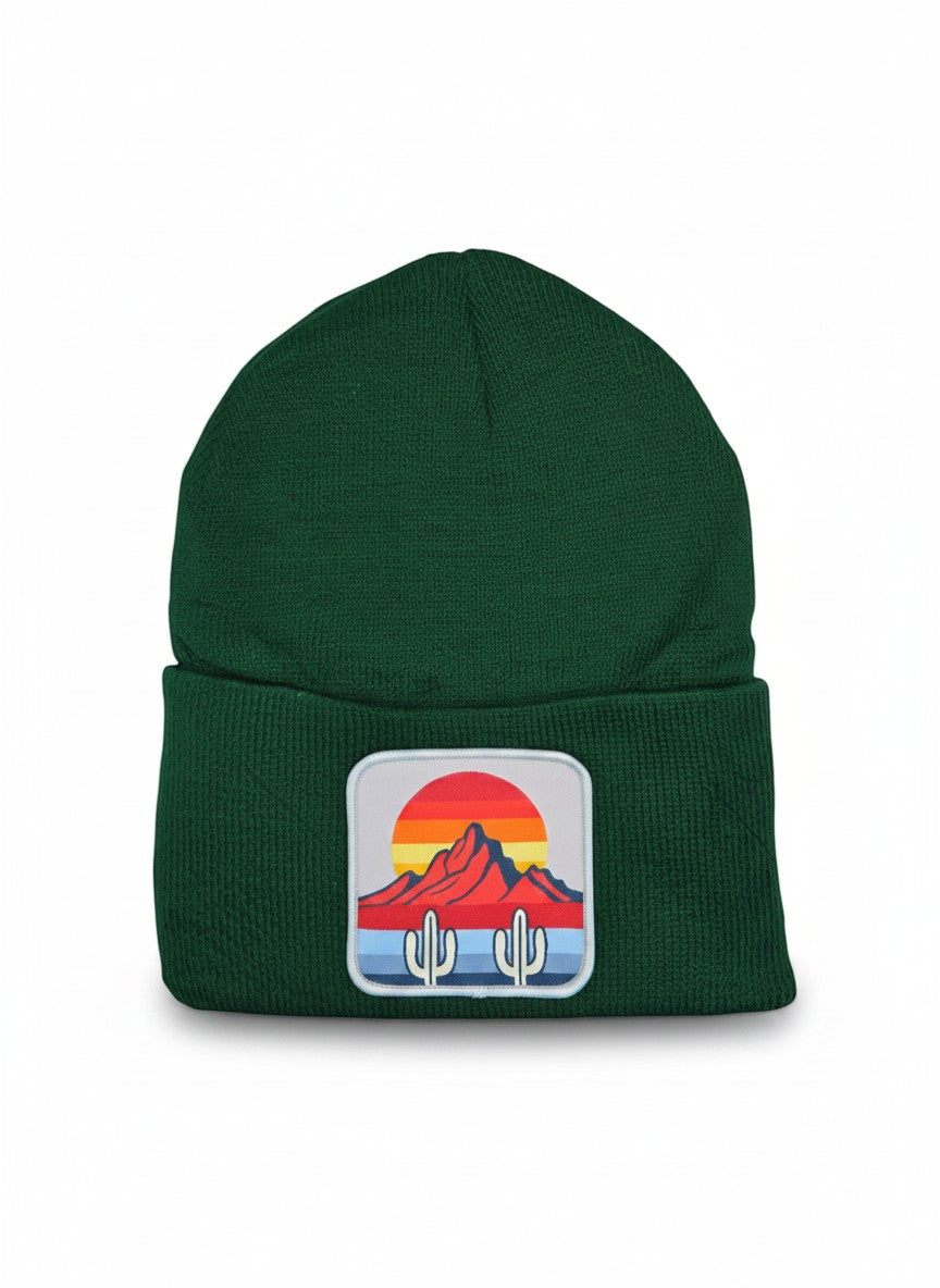 Moove Headwear dark green knit beanie with a desert sunset cactus patch. Features a ribbed cuff.
