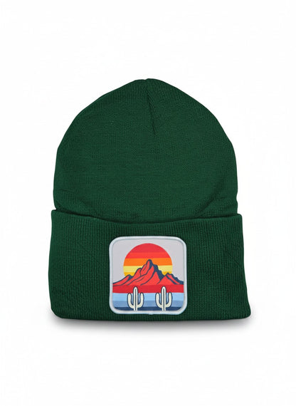 Moove Headwear dark green knit beanie with a desert sunset cactus patch. Features a ribbed cuff.