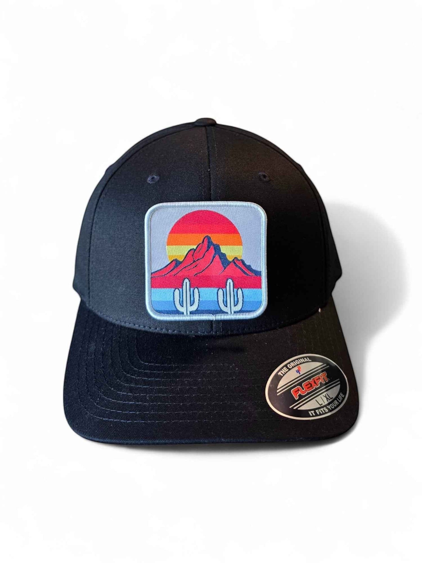 Moove Headwear black fitted hat with a desert sunset cactus mountain patch. Mid-profile structured crown.