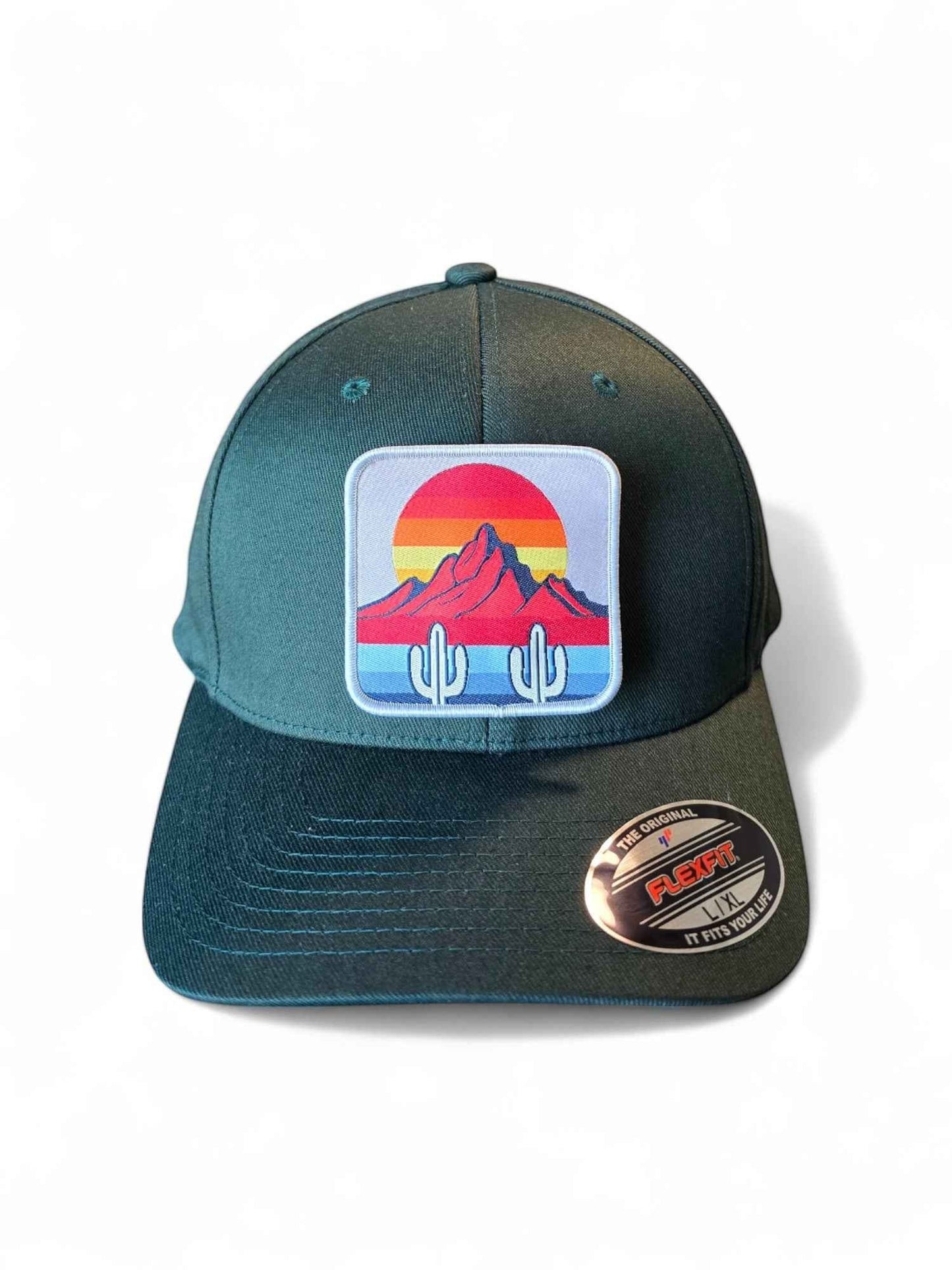 Moove Headwear dark green fitted hat with cactus and mountain sunset patch. Mid-profile structured crown.