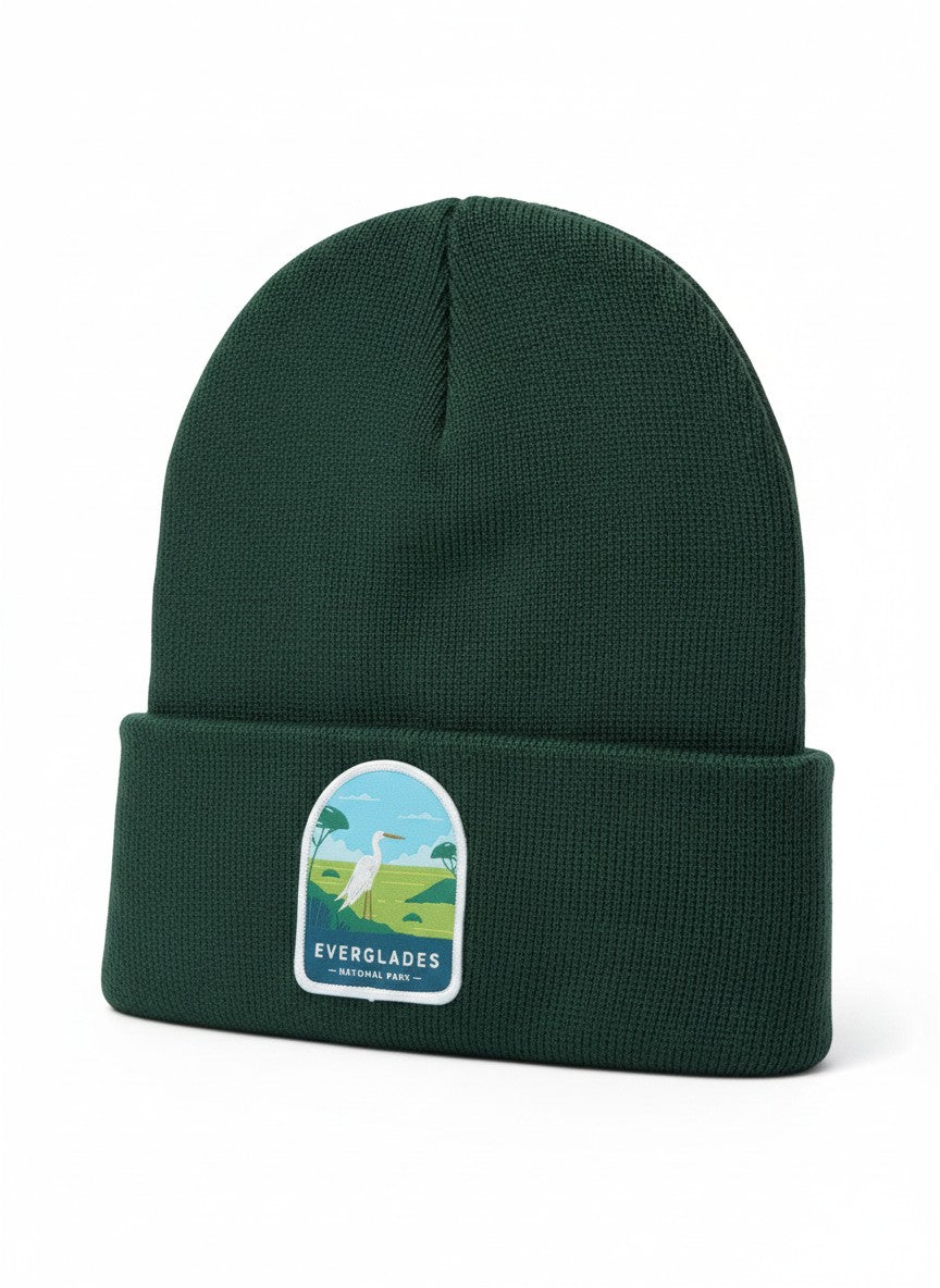 Moove Headwear dark green knit beanie with a patch depicting a white egret in the Everglades National Park.