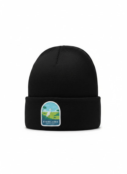 Moove Headwear black knit beanie with Everglades National Park patch featuring a white egret and tropical landscape.