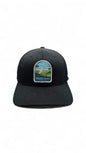 Moove Headwear black fitted hat with embroidered Everglades National Park patch featuring a white egret and palm trees.