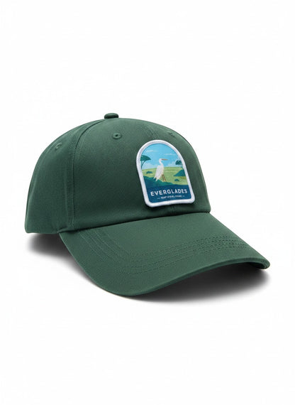 Moove Headwear dark green embroidered baseball cap with Everglades National Park patch featuring a white egret and palm trees.