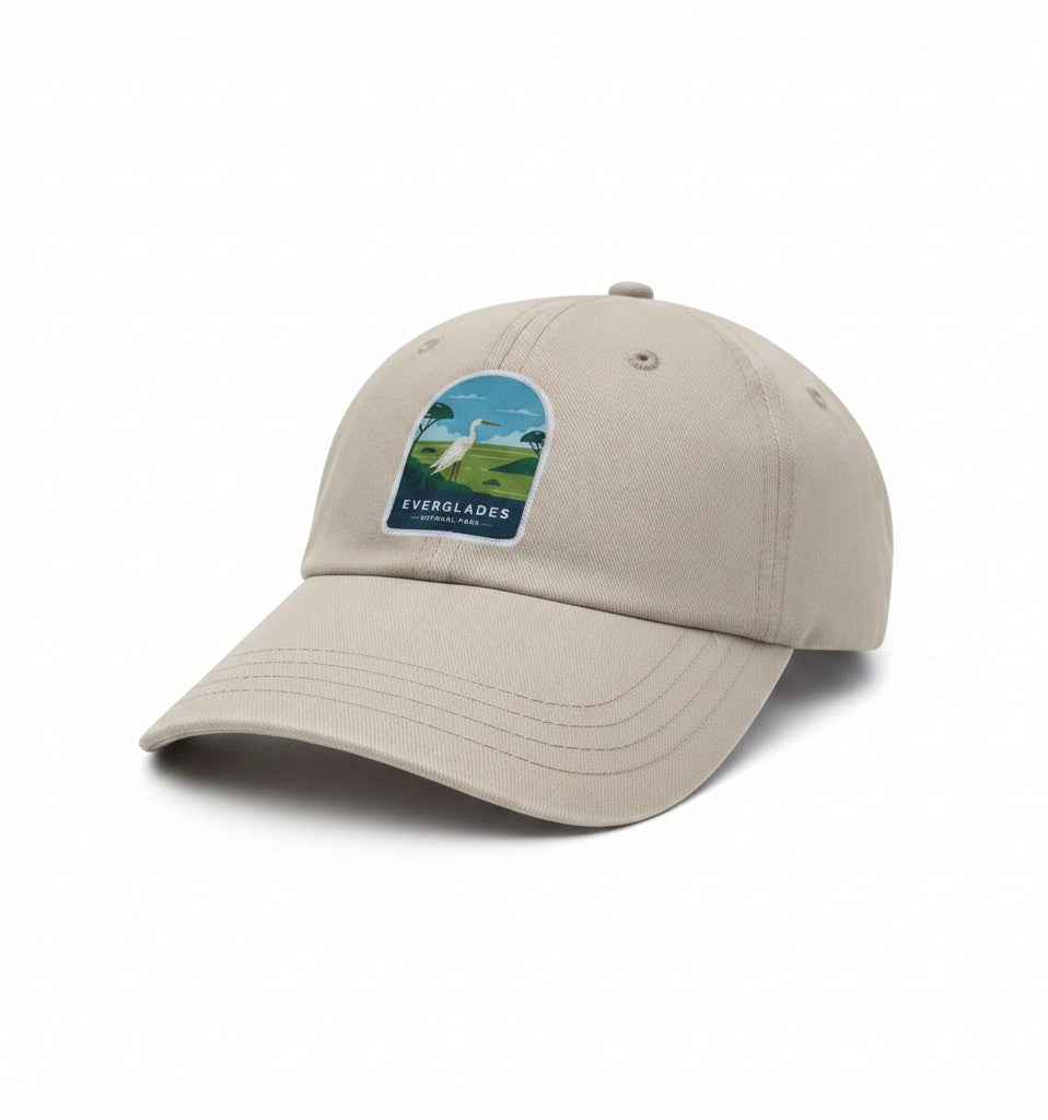 Moove Headwear tan baseball cap with embroidered Everglades National Park patch featuring a white egret and palm trees.