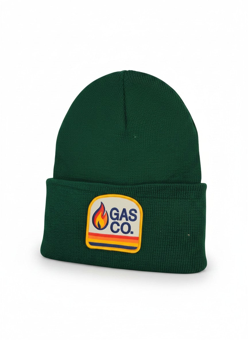 Moove Headwear dark green cuffed knit beanie with a Gas Co. flame logo patch. Unisex fit.