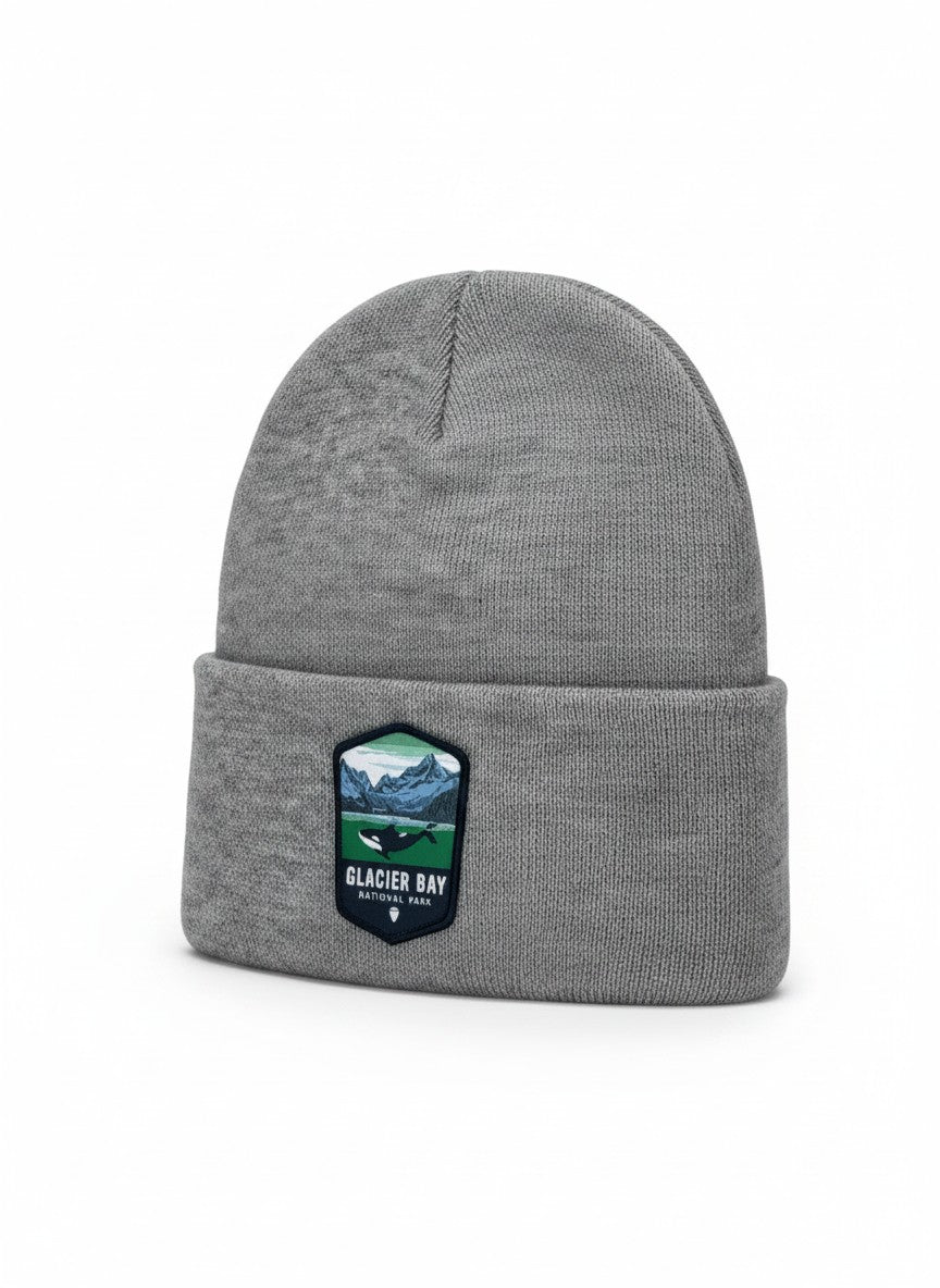 Moove Headwear grey knit beanie with Glacier Bay National Park patch featuring an orca whale and mountains.