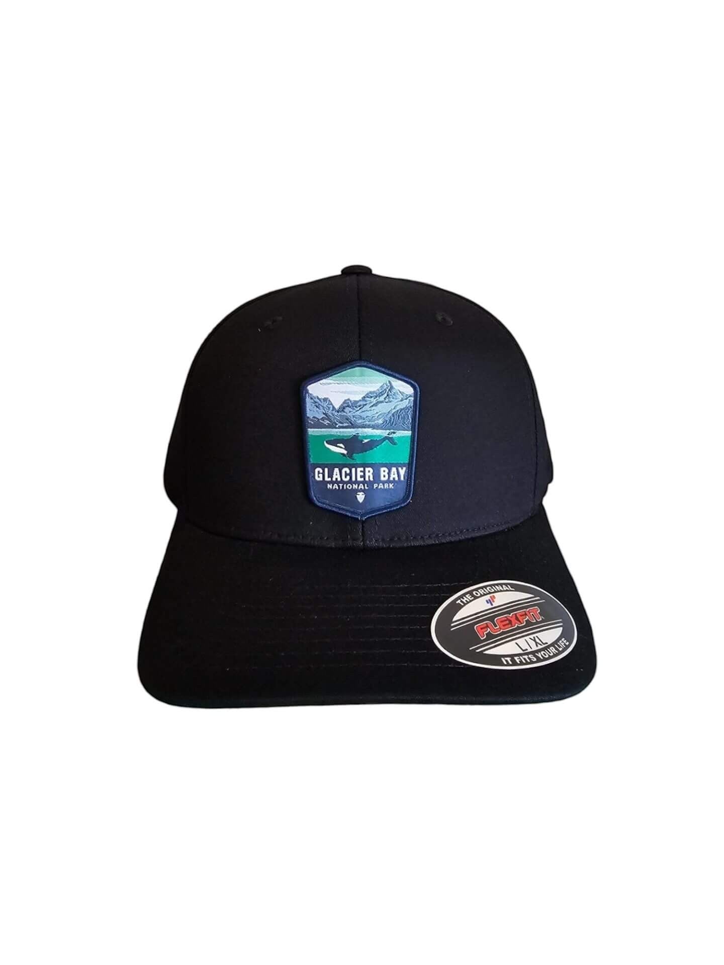 Moove Headwear black fitted hat with Glacier Bay National Park patch featuring a whale and mountains. Acrylic, cotton, PU spandex blend.