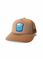 Moove Headwear tan suede trucker hat with mesh back and Glacier Bay National Park patch.