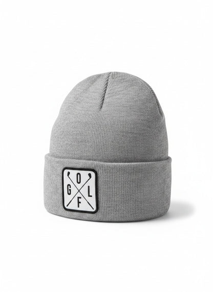 Moove Headwear grey acrylic knit beanie with a white square patch featuring crossed golf clubs and the word GOLF.