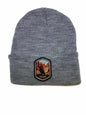 Moove Headwear grey acrylic rib-knit beanie with a woven patch featuring a bird and the Grand Canyon.
