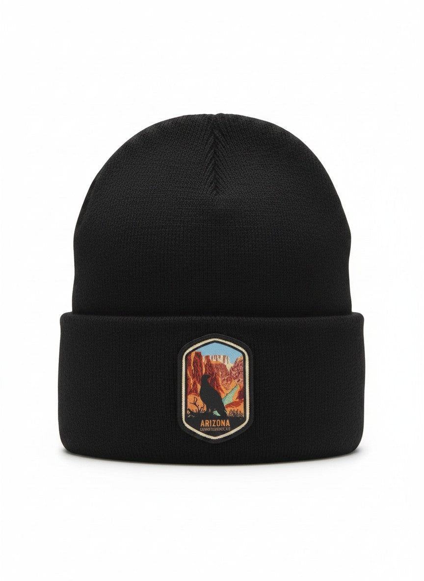 Moove Headwear black acrylic rib-knit beanie with a woven patch depicting the Grand Canyon and a bird.