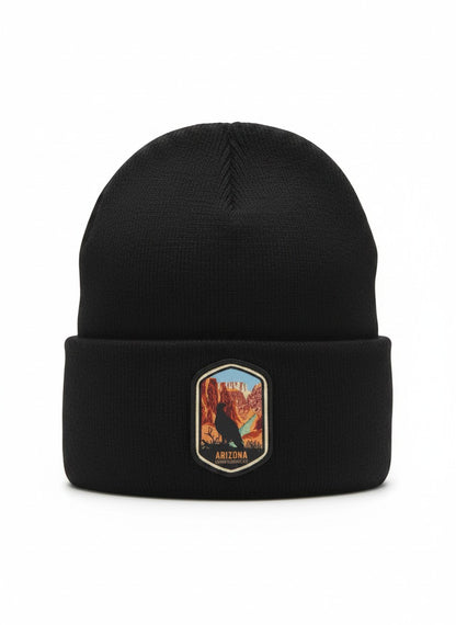 Moove Headwear black acrylic rib-knit beanie with a woven patch depicting the Grand Canyon and a bird.