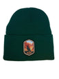 Moove Headwear dark green acrylic rib-knit beanie with a woven patch depicting the Grand Canyon and a bird.