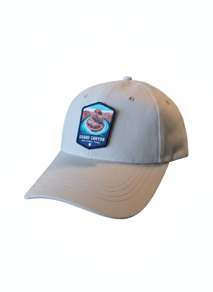 Moove Headwear tan baseball cap with Grand Canyon National Park embroidered patch. Adjustable strap.