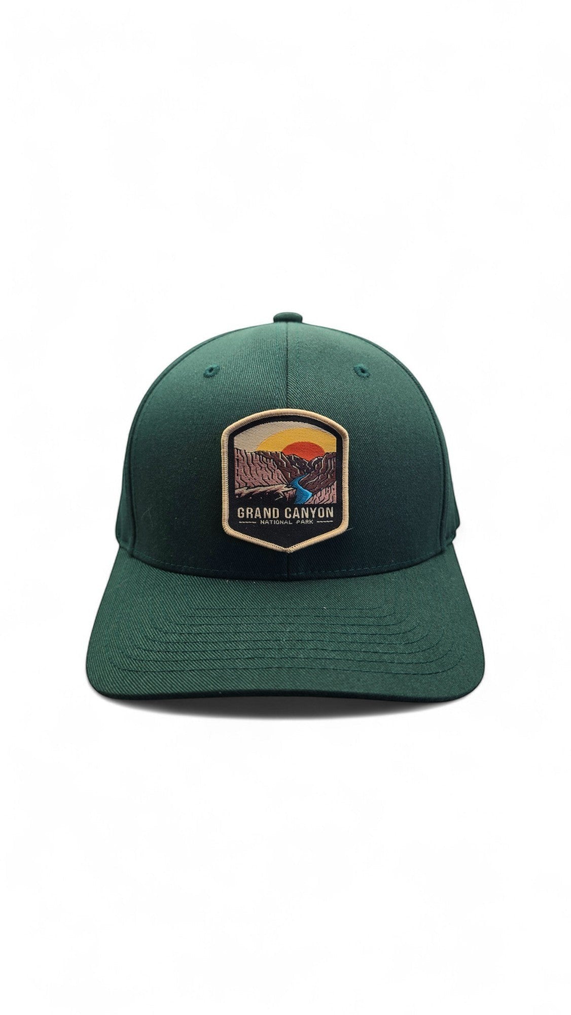 Moove Headwear dark green Flexfit baseball cap with embroidered Grand Canyon patch and sunset scene.