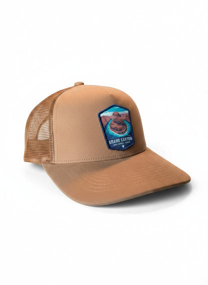 Moove Headwear tan suede baseball cap with Grand Canyon National Park embroidered patch and mesh back panels.