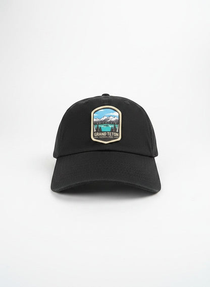 Moove Headwear black cotton dad hat with Grand Teton National Park embroidered patch and adjustable strap.