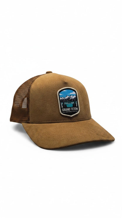 Moove Headwear brown suede and mesh dad hat with Grand Teton National Park embroidered patch. Features breathable mesh back.