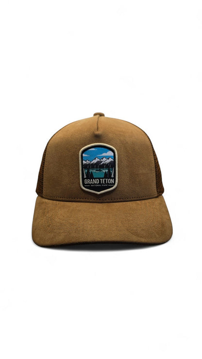 Moove Headwear brown suede and mesh dad hat with Grand Teton National Park embroidered patch. Features breathable mesh panels.