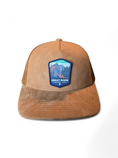 Moove Headwear tan suede trucker hat with mesh back and Great Basin National Park patch.