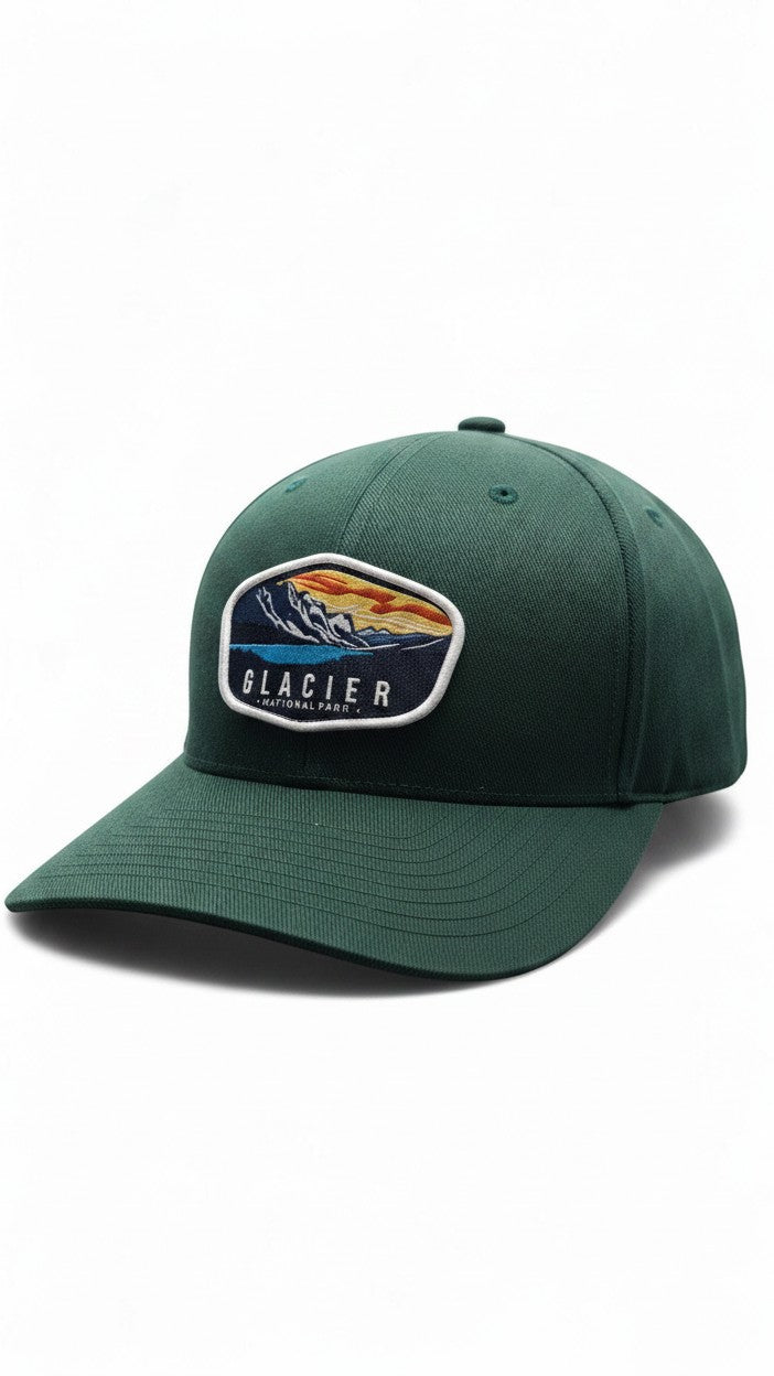 Moove Headwear green baseball cap with embroidered Glacier National Park landscape patch. Adjustable hiking cap.
