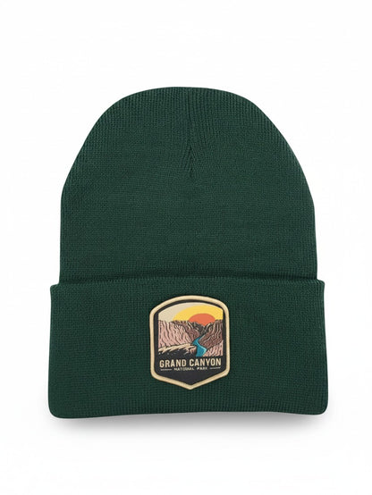 Moove Headwear dark green knit beanie featuring a Grand Canyon National Park patch with a sunset landscape design.