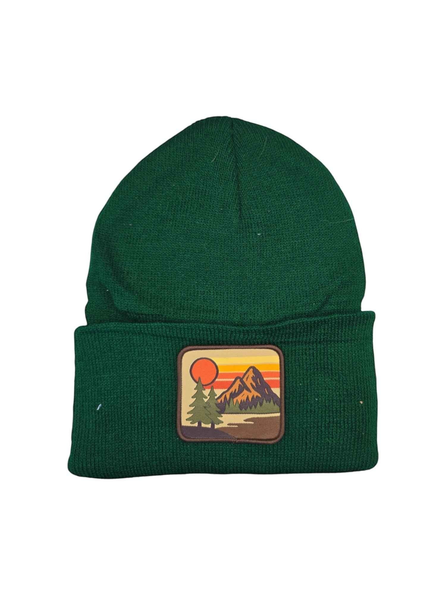 Moove Headwear forest green knit beanie with vintage mountain sunset patch. Unisex, one size fits most.