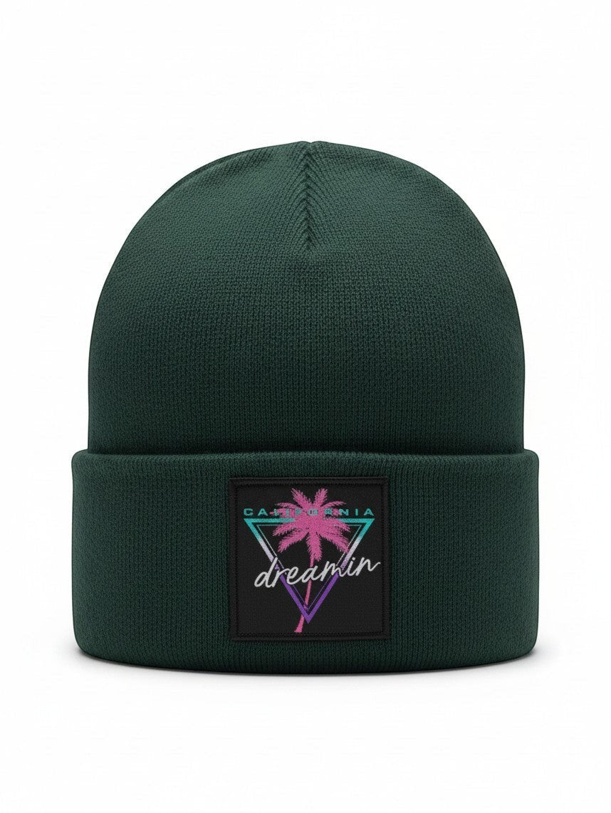 Moove Headwear dark green knit beanie with a retro 80s style California Dreamin palm tree patch on the front cuff.