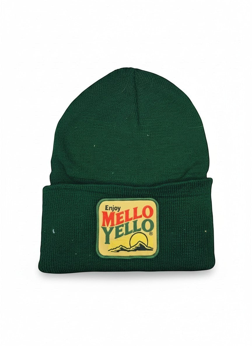 Moove Headwear green knit beanie with a retro Mello Yello patch featuring a sun and mountains.